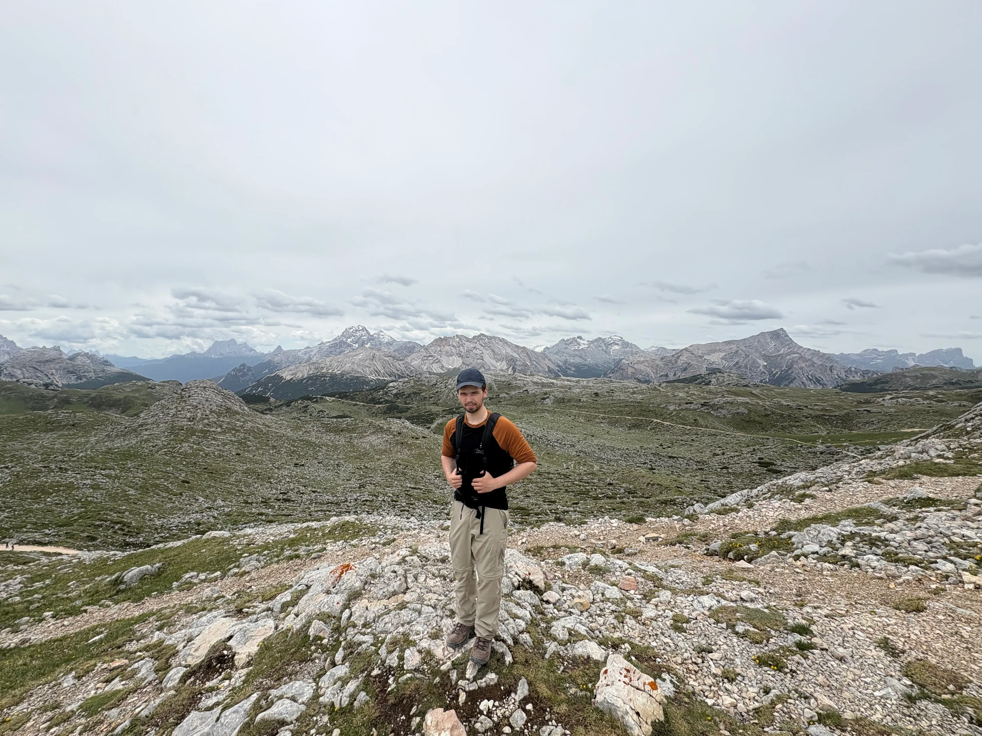 Nicolas standing on a rocky trail in the Dolomites