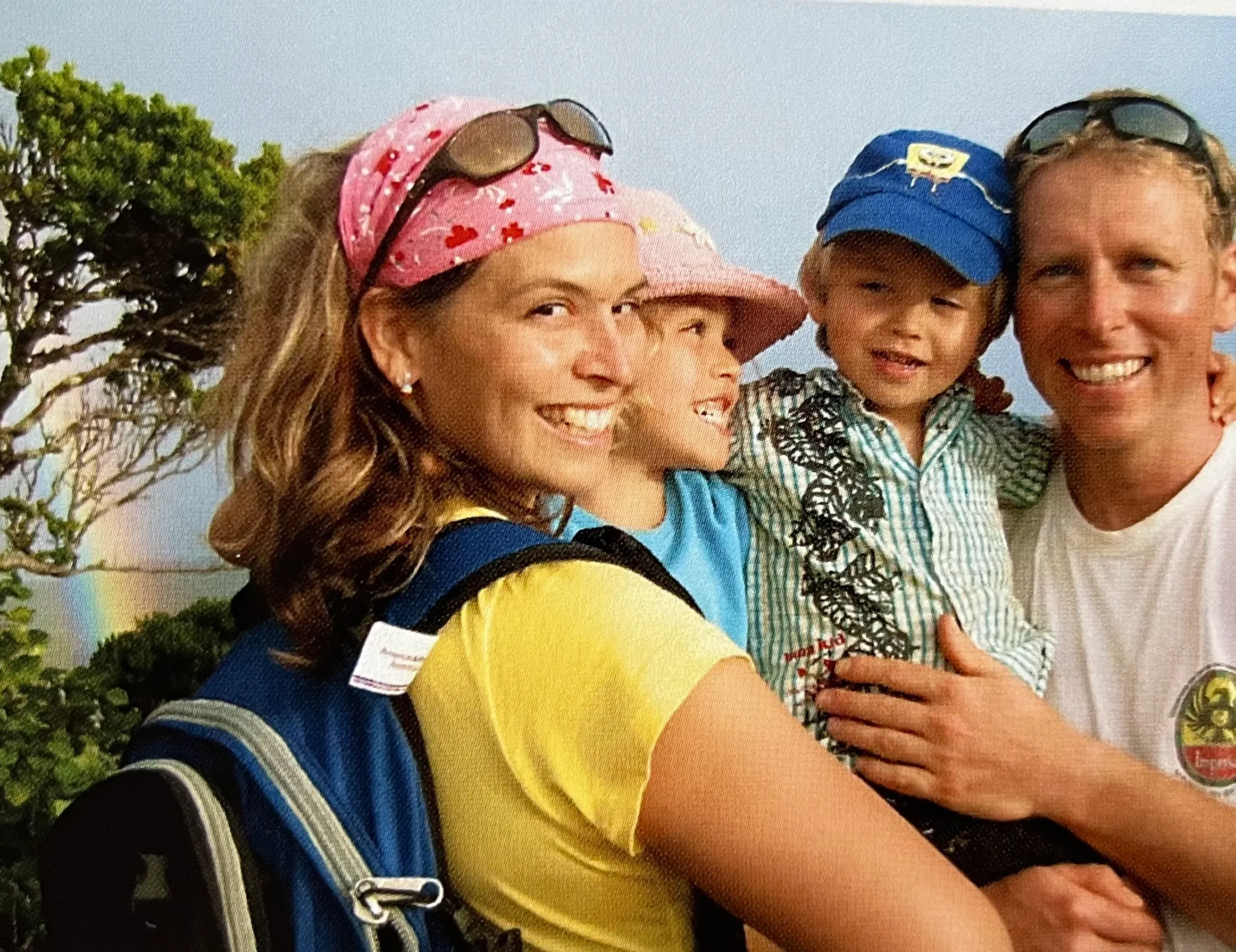 A family smiling together during a trip
